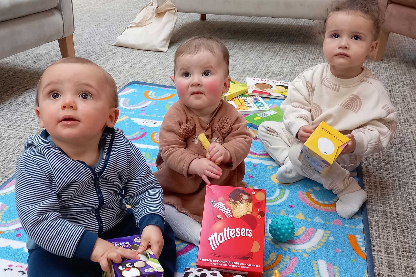 Adorable babies at Koala North West's Full Circle event, engaging in Easter activities - discover our supportive community programs.